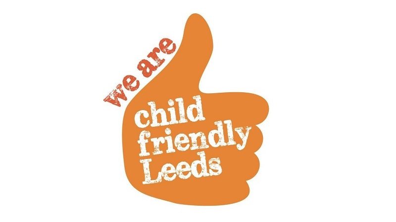 Child Friendly Leeds logo - orange hand with thumbs up. Text reads - we are child friendly leeds