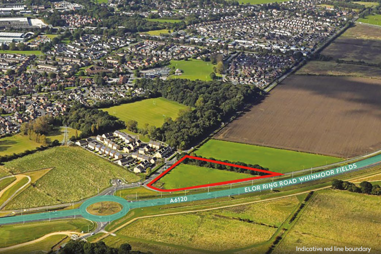 A picture of fields with red outline for the designated area
