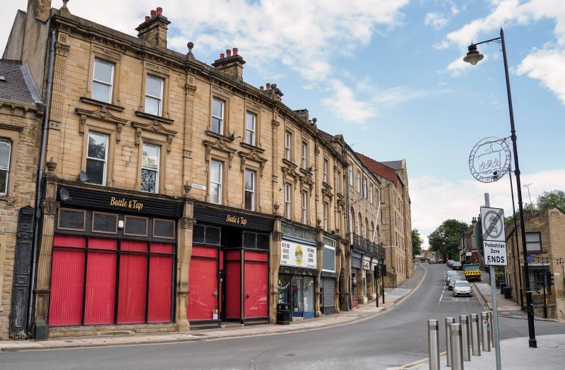 Row of business premises on street in town centre