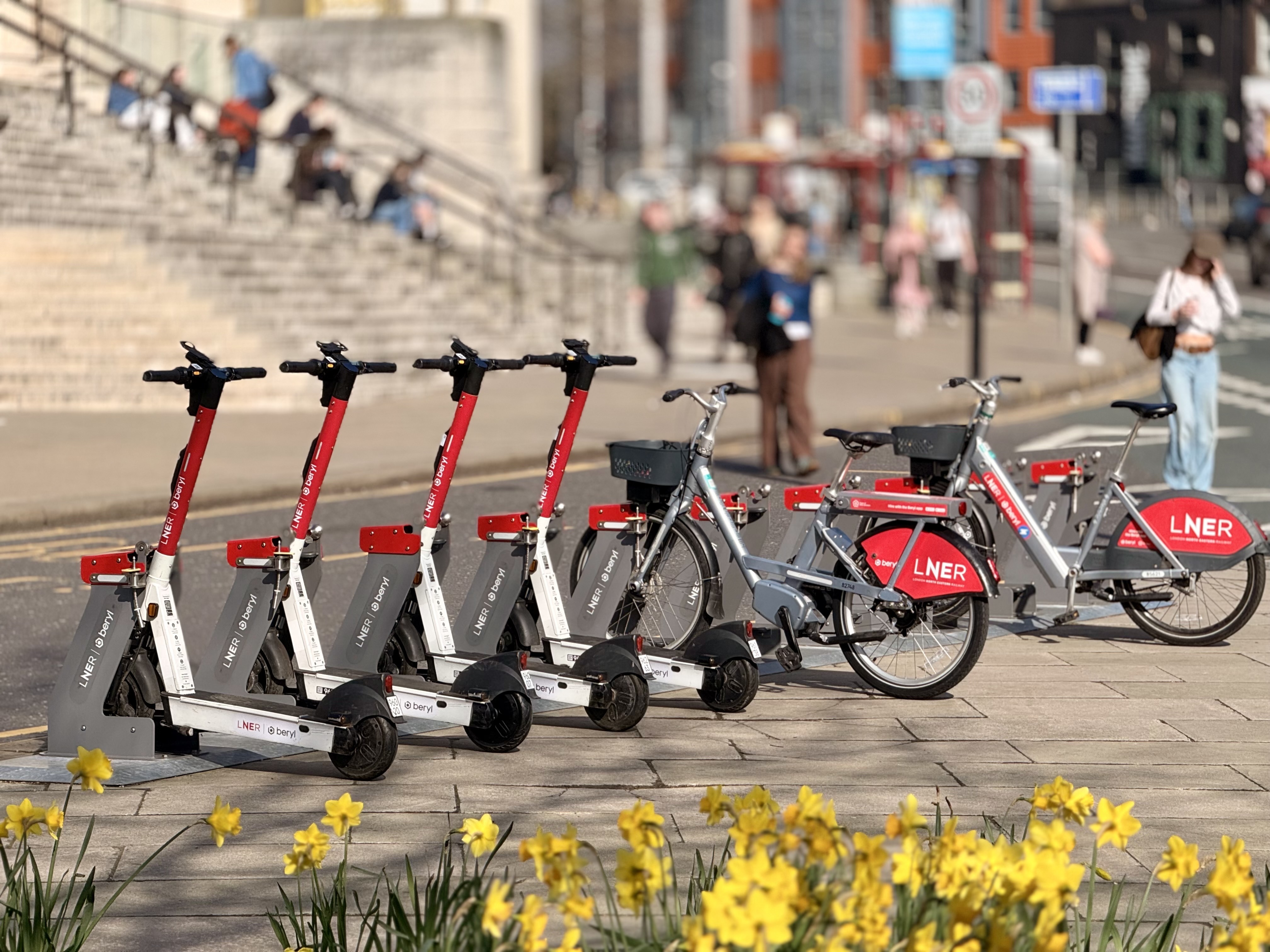 Row of electric scooters and bikes in Leeds city centre