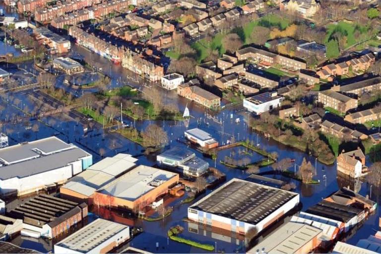 Bird's eye view of Kirkstall with roads covered in water between buildings