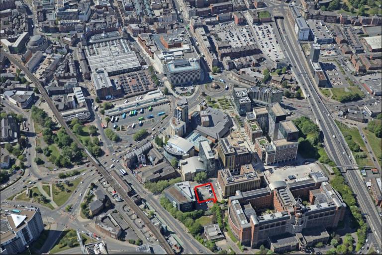 Birds eye of eye of Leeds city centre showing lots of buildings, roads, vehicles from above