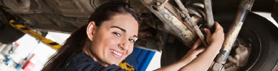 women fixing car